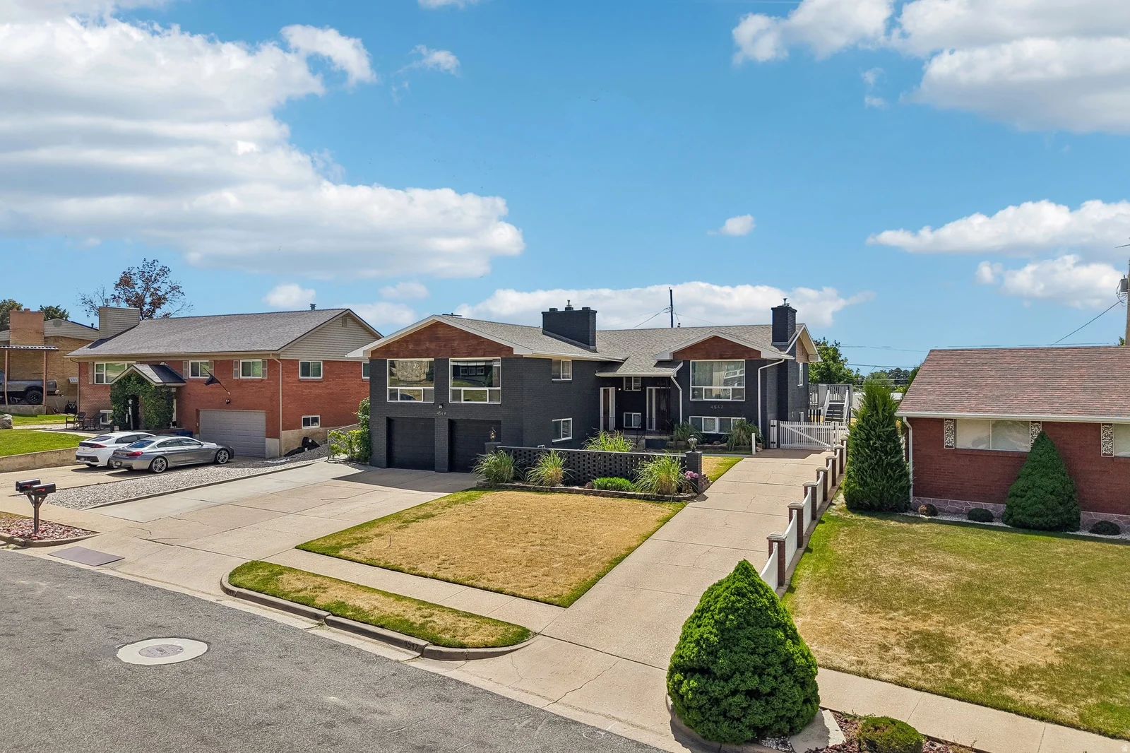 Dark-toned exterior featuring prominent architectural elements and multiple windows
